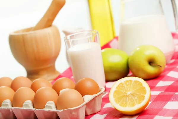 Milk in a glass jar and eggs Stock Image