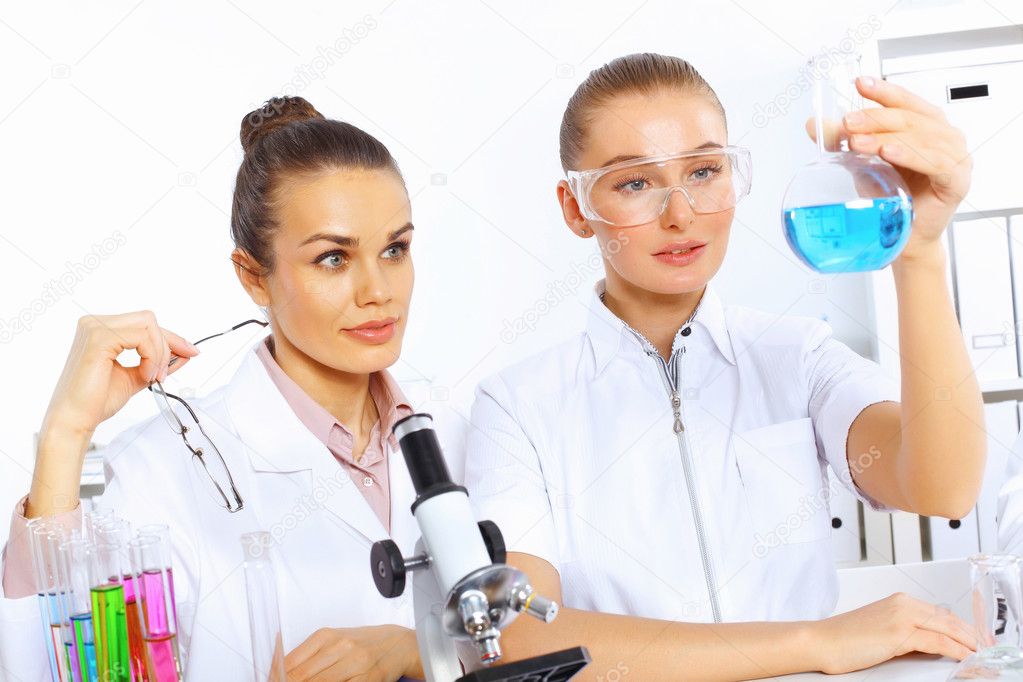 Team of scientists working in laboratory