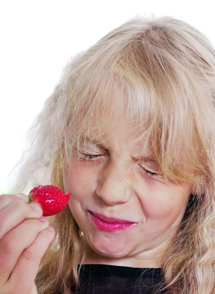 Girl is eating strawberry. — Stock Photo, Image