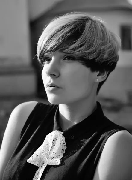 Beautiful girl with modern haircut posing in the street. — Stock Image Beautiful girl with modern haircut posing in the street. Stock Image