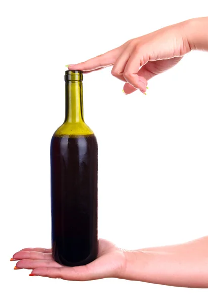 A bottle of red wine in hand — Stock Photo, Image