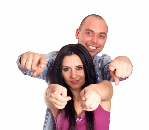 Portrait of happy young couple pointing at you over white backgr — Stock Photo, Image