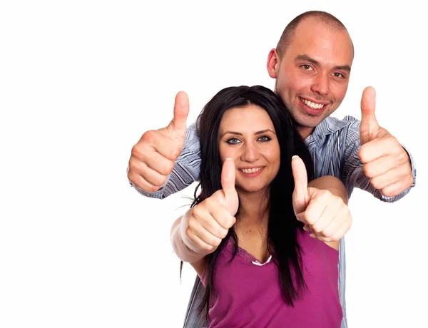 Двоє молодих посміхається з жестом великими пальцями ізольовані на білому — стокове фото