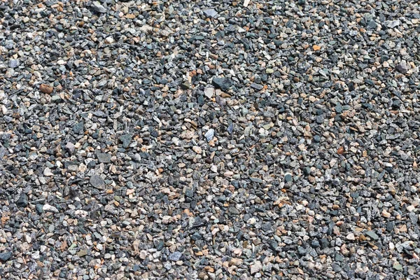 Achtergrond van grijs graniet grind — Stockfoto