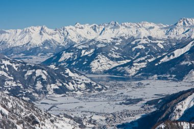 Ski resort and the mountains of Zell am See, Austrian Alps at wi clipart