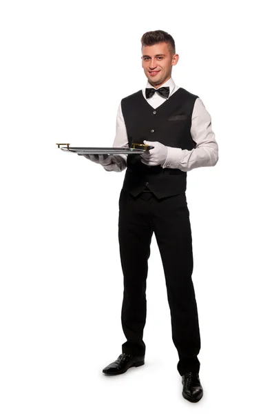 Mladík číšník s podnosem — Stock fotografie