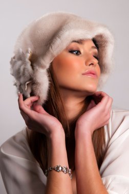 Woman in a fur hat clipart