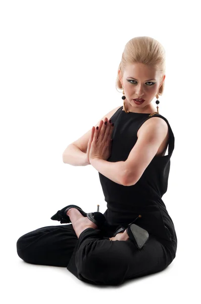 Girl sitting in the lotus position — Stock Photo, Image