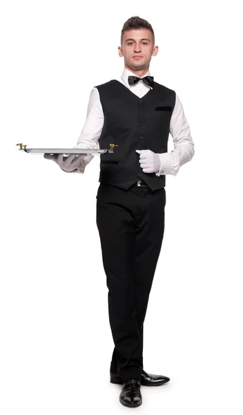 Ein junger Kellner mit einem Tablett — Stockfoto