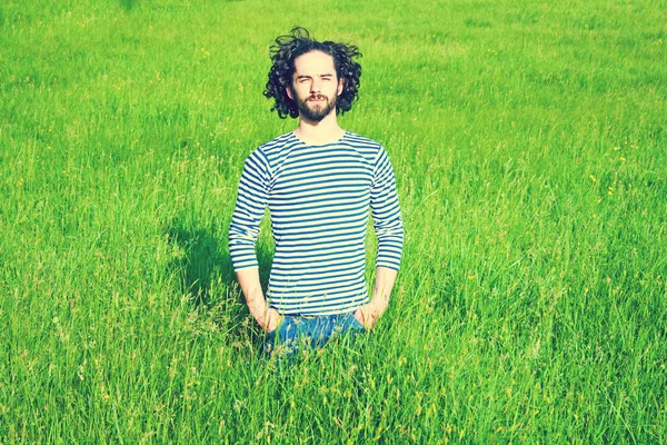 Man in bright grass — Stock Photo, Image