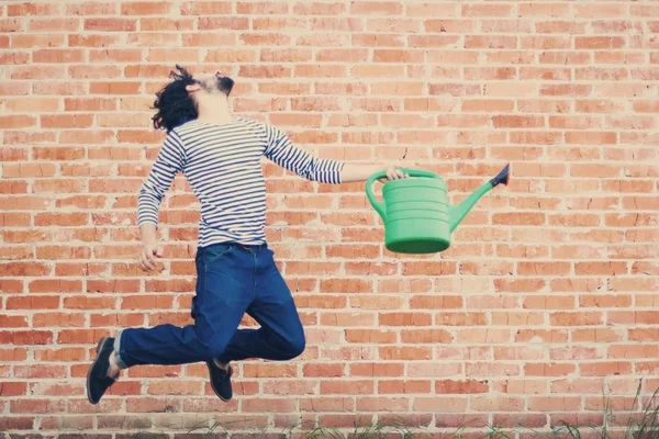 Коллаж в красивом мужчине в прыжке — стоковое фото