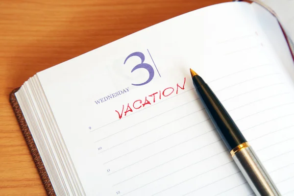 stock image The daily log with an inscription vacation and pen