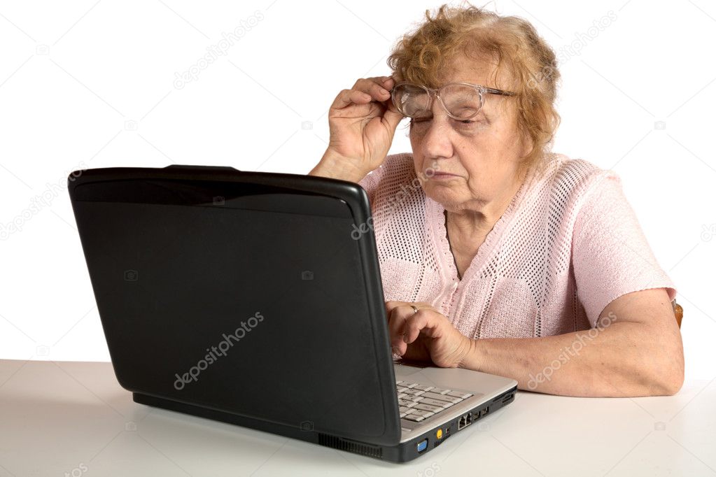 Granny with the laptop isolated on a white
