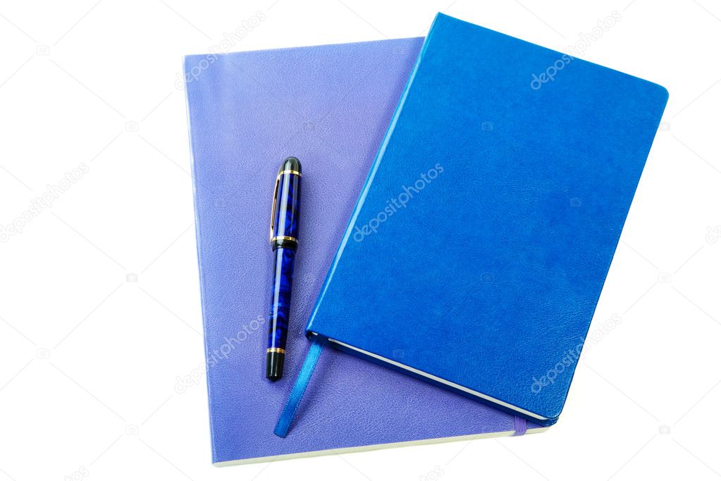 Dark blue writing-books and fountain pen isolated on a white