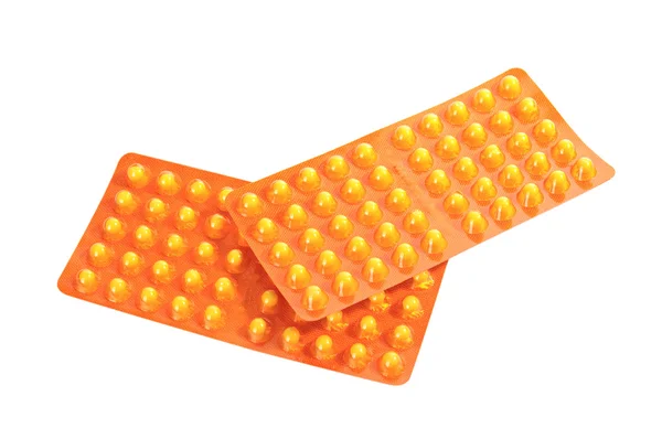 Пакет з жовтими вітамінними таблетками — стокове фото
