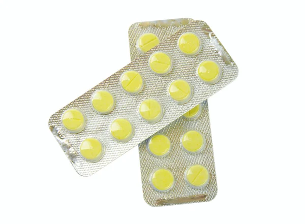 Sarı tabletler ile paket — Stok fotoğraf