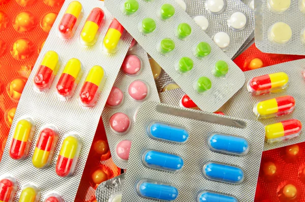 Vícebarevné medicína tabletky pozadí — Stock fotografie