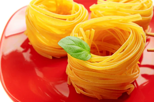 Pasta nests on a dish — Stock Photo, Image