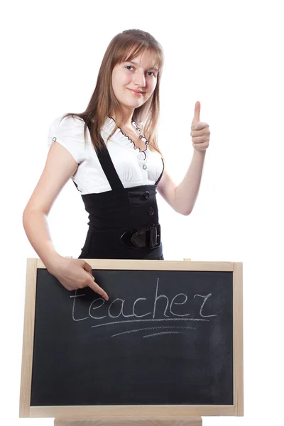 Girl about a blackboard shows on a word the teacher — Stock Photo, Image
