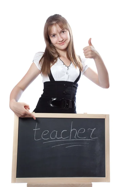 La muchacha sobre la pizarra muestra en una palabra al maestro — Foto de Stock
