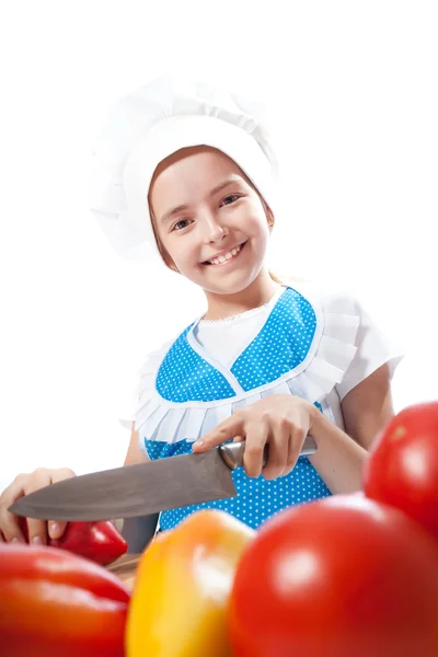 Piccolo chef felice cuoco taglia peperone — Foto Stock