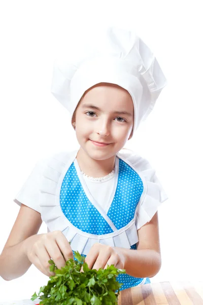 Happy little chef cook with parsley — Stok Foto