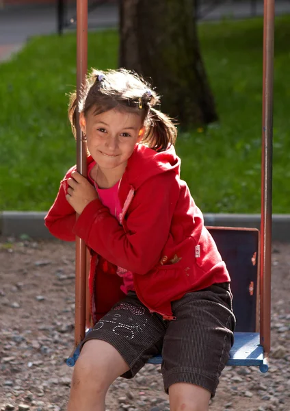 Young girl on swing outdoor — Stock Photo, Image