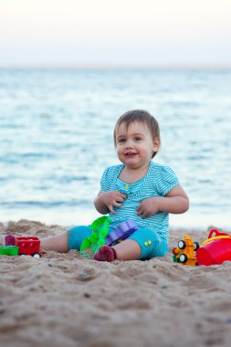 Toddler on sand beach clipart