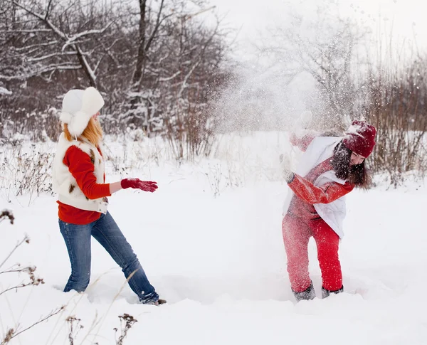 Girls plays with snow — Stock Photo, Image