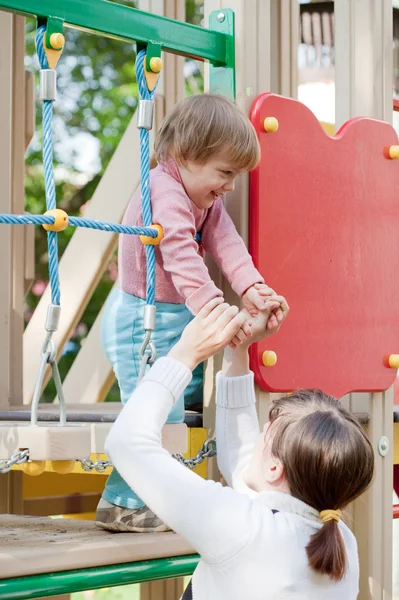 Mother with child at playground — Stock Photo, Image