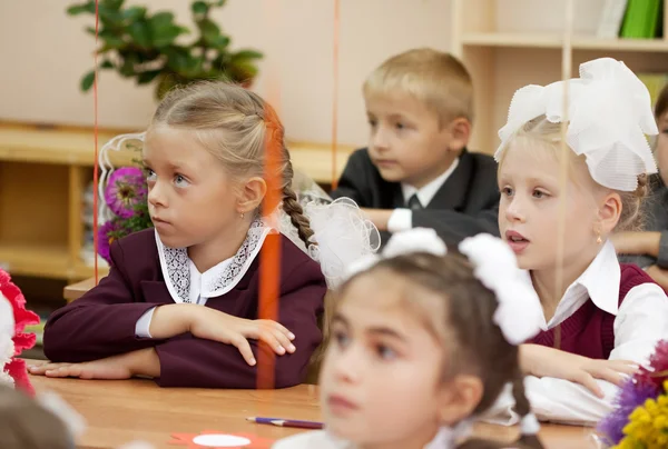 Schoolchildren in their first lesson — Stock Photo, Image