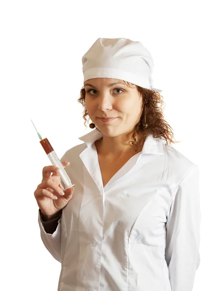 Sjuksköterska med spruta över vita — Stockfoto