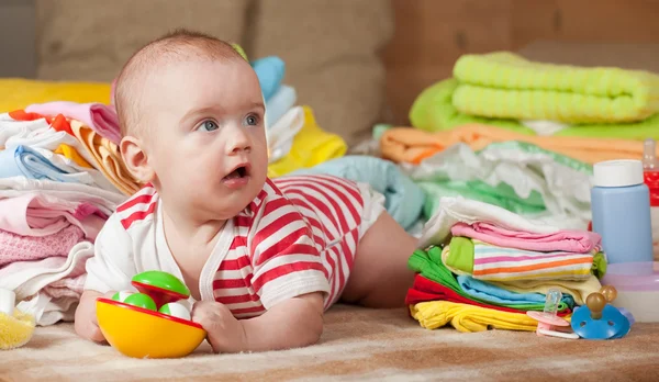 stock image Baby girl with baby's things