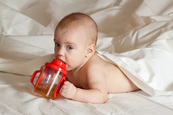 Baby girl with sippy cup — Stock Photo, Image