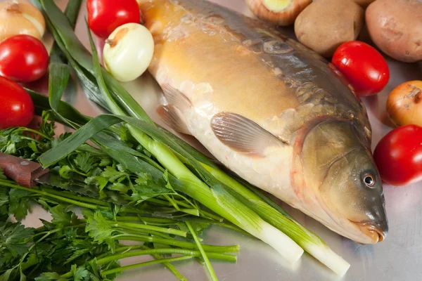 Carp fish with vegetables — Stock Photo, Image