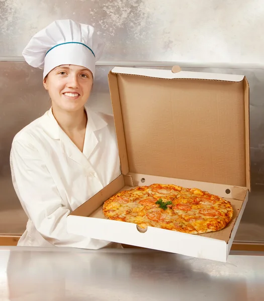 Female cook with fresh pizza — Stock Photo, Image