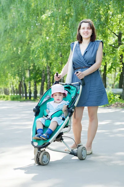Mother with stroller — Stock Photo, Image