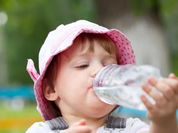 2 years baby drinks from bottle — Stock Photo, Image