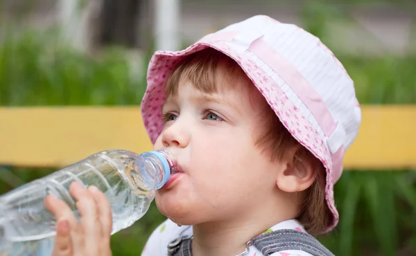 Child drinking from bottle — Stock Photo, Image