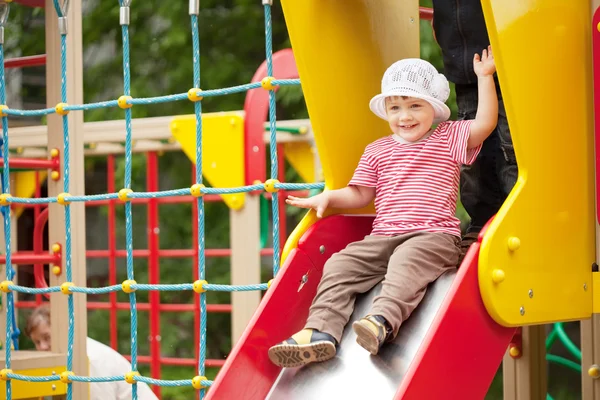 Two-year child on slide — Stock Photo, Image