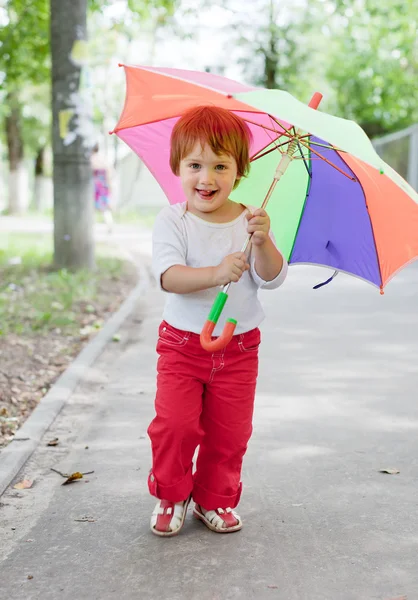 Girl with umbrella in summer street — Stock Photo, Image