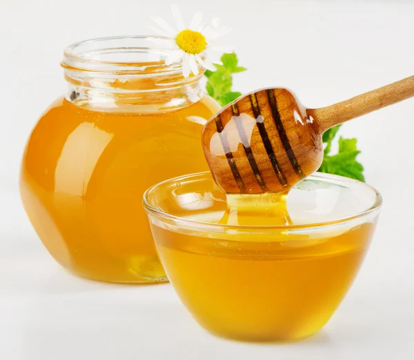 Honey in glass jars — Stock Photo, Image