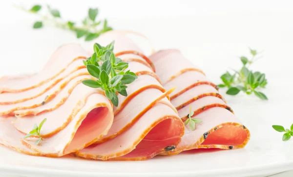 Slices of ham and herbs — Stock Photo, Image
