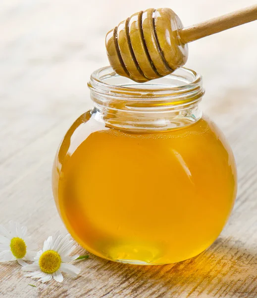 Honey in glass jars — Stock Photo, Image