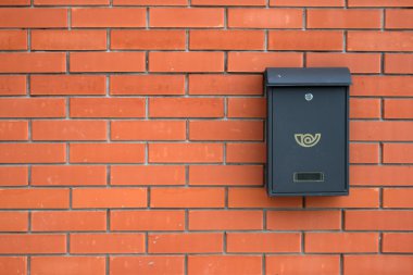 Mail-box over red brick wall clipart