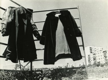 Winter clothes drying in the courtyard clipart