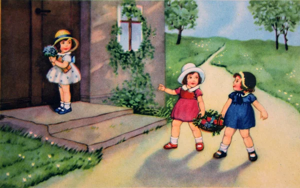 Three girls with gifts in front of the house — Stock Photo, Image