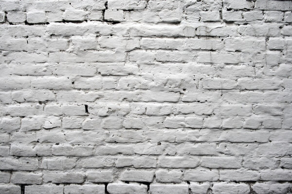 Old brick wall painted in white