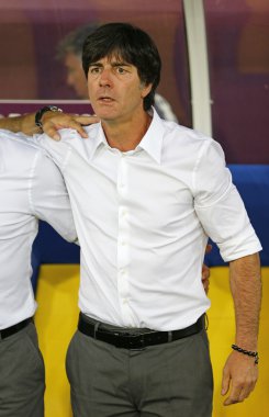 Germany national team head coach Joachim Low looks on during UEF clipart