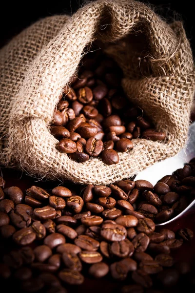 Coffee beans spilling — Stock Photo, Image